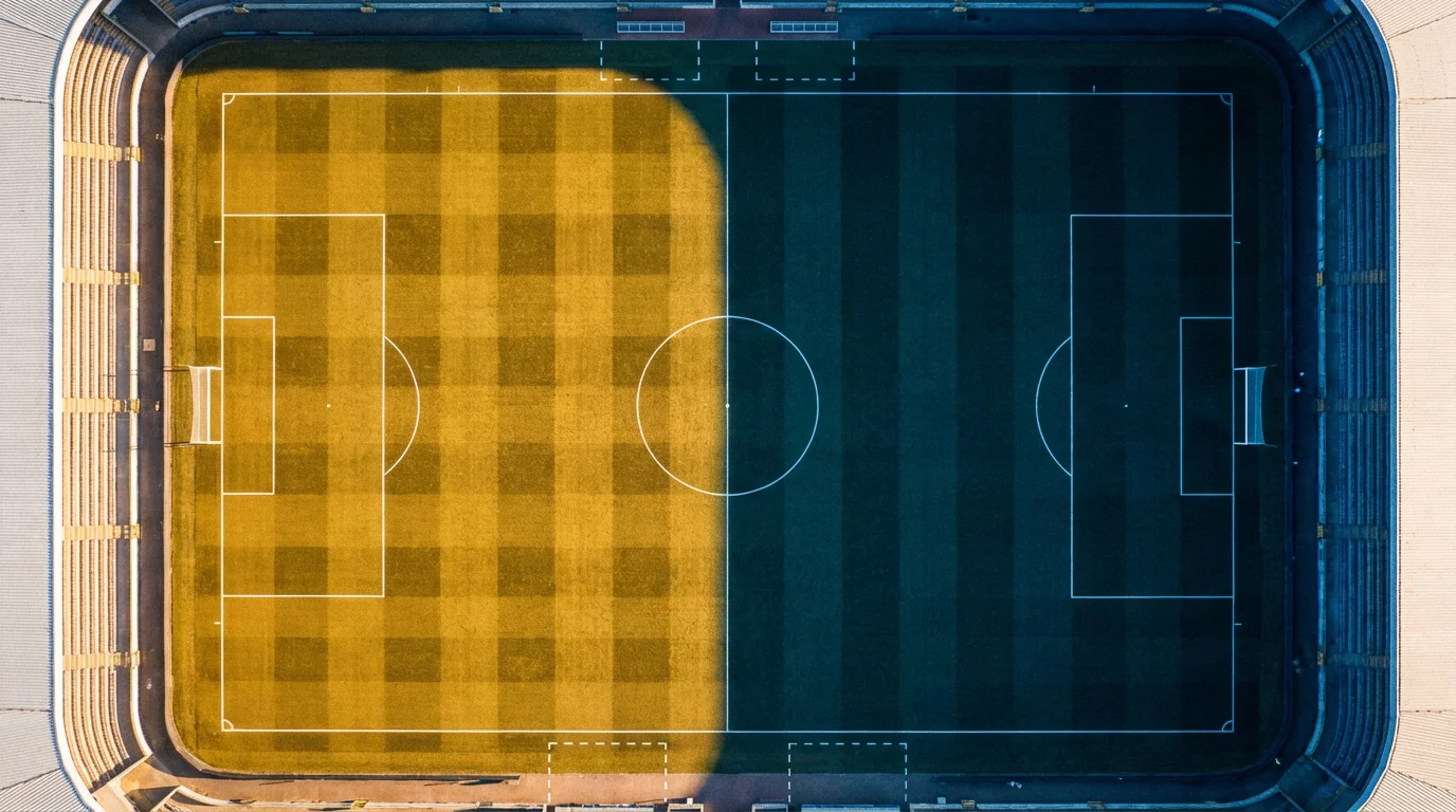 Football pitch split down the middle with one team attacking and the other defending