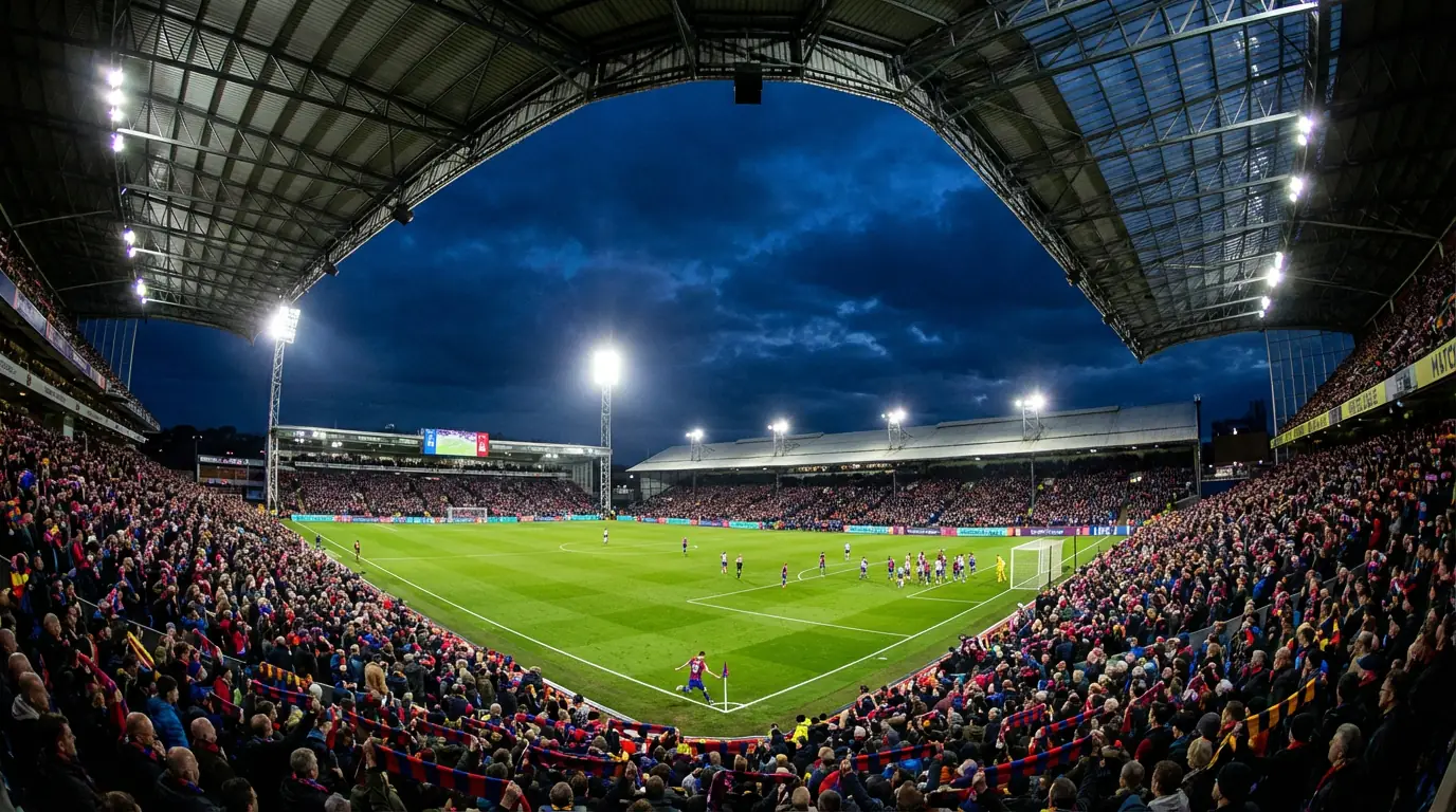 Premier League football match under floodlights with packed stands and green pitch